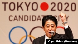 Japanese Prime Minister Shinzo Abe speaks during a Tokyo 2020 kickoff rally in Tokyo in August 2013.