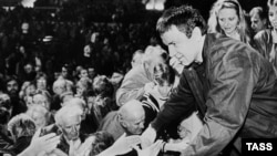 Russian mystic Anatoly Kashpirovsky's fame extended throughout the former Soviet bloc, including among Czechs like these fans in Prague in 1992.