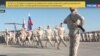 Russian troops march at the Hmeimim military base in Syria.