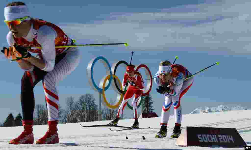 (From left) Austria's Katerina Smutna, Poland's Kornelia Kubinska and France's Aurore Jean compete in the women's cross-country skiing 4x5km relay. (AFP/Kirril Kudryavtsev)