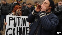 Anti-Putin demonstrators rally in Yerevan on December 2.