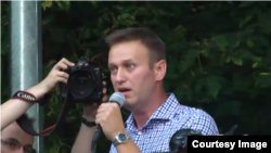 Opposition leader Aleksei Navalny addresses demonstrators protesting against new antiterror legislation in Russia on August 9. 