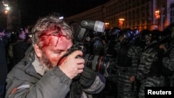 Reuters photographer Gleb Garanich was injured by riot police in the crackdown.