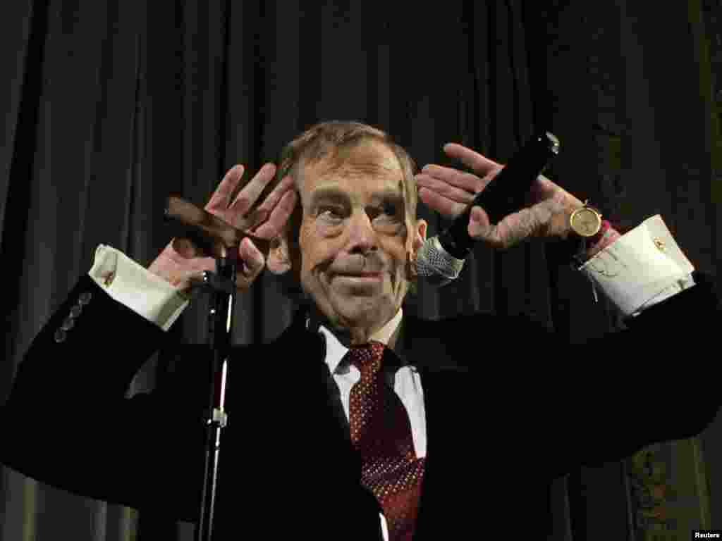 Havel waves to the audience after a premiere of his new movie &quot;Leaving&quot; in Prague in March 2011.