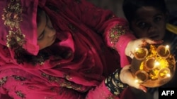 A Pakistani Hindu women celebrating a religious festival.