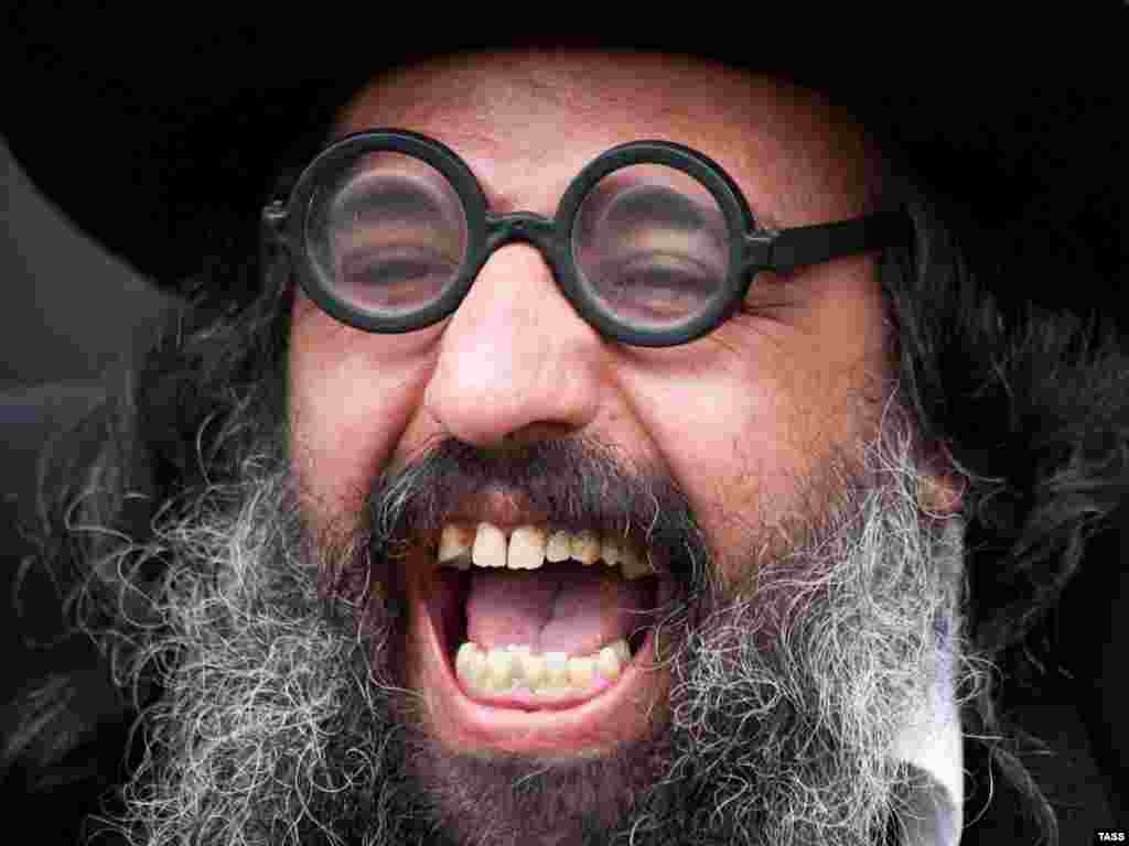 A man enjoys celebrations for Rosh Hashana, the Jewish New Year, in the Ukrainian city of Uman on September 9. Photo by Vladimir Astapkovich for ITAR-TASS