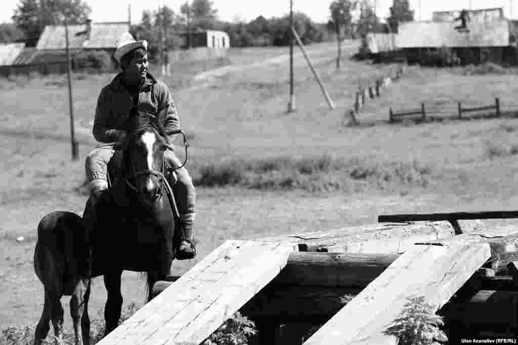 The village of Kutugun in the Irkutsk region. Some Kyrgyz migrants keep horses to produce kumis, a mildly alcoholic drink made from fermented horse milk.