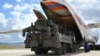 A Russian military cargo plane unloads an S-400 missile-defense system at a military airbase in Turkey in July 2019.