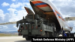 A Russian military cargo plane unloads elements of the S-400 missile-defense system at a military air base in Ankara on July 12.