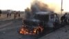 A truck that belonged to Shi'ite Muslim rebels burns during clashes in Aden on March 26.