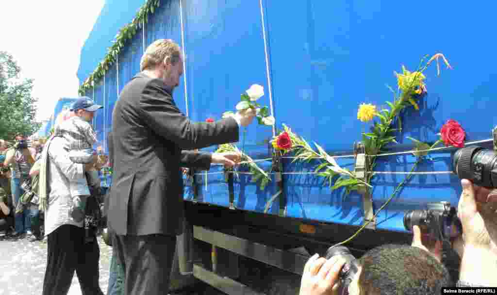 More flowers being placed on the trucks.