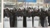 Riot police stand on duty in the western city of Aqtau, where the Kazakh authorities have maintained a heavy presence on the streets.