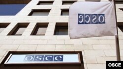 Logo i zastava OSCE-a