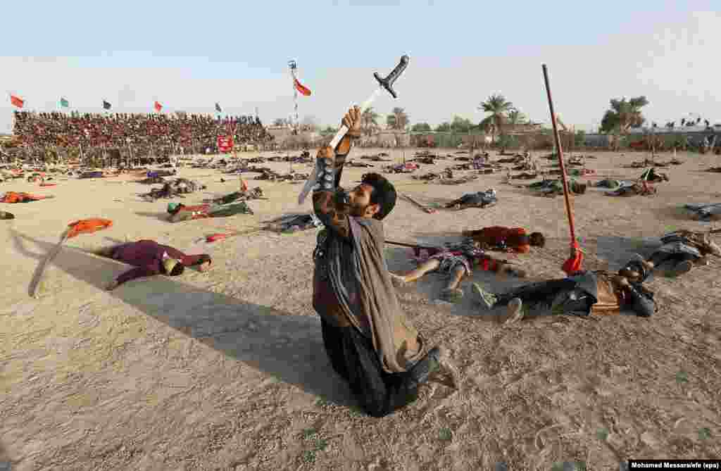 Iraqi actors perform the epic of Imam Hussein as part of the Ashura festival in Baghdad on October 1. (epa-EFE/Mohamed Messara)