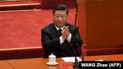 Қытайдағы реформалар мен ашықтық саясатының 40 жылдығын атап өту шарасында отырған Қытай басшысы Си Цзиньпин. 18 желтоқсан 2018 жыл