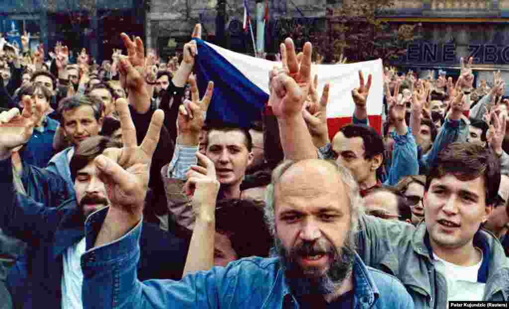 The next protest was held on October 28, 1989, the anniversary of the founding of Czechoslovakia in 1918. Demonstrators flashed victory signs as they demanded freedom and democracy on Wenceslas Square in Prague.