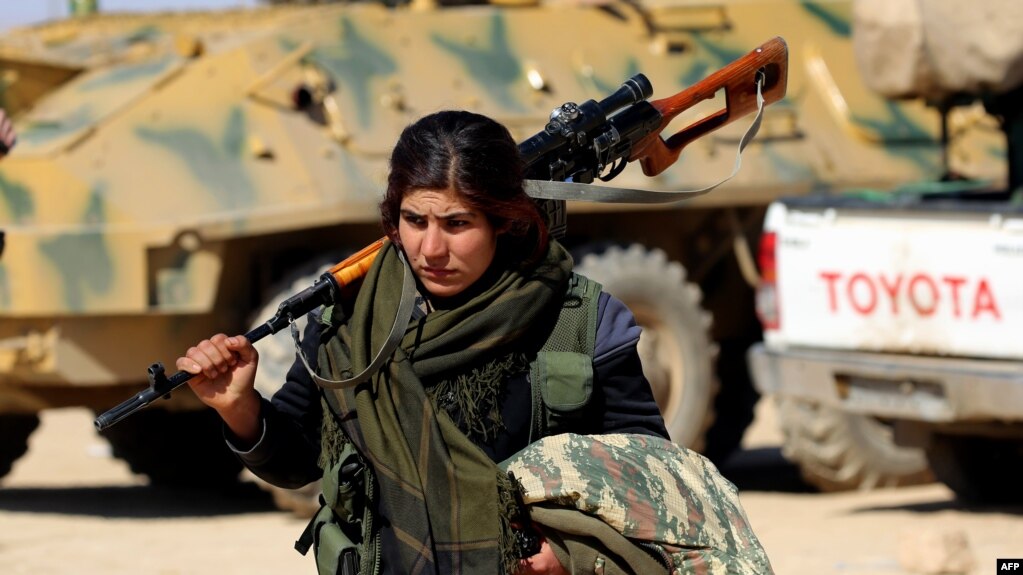 A female Kurdish fighter of the U.S.-backed Syrian Democratic Forces (file photo)