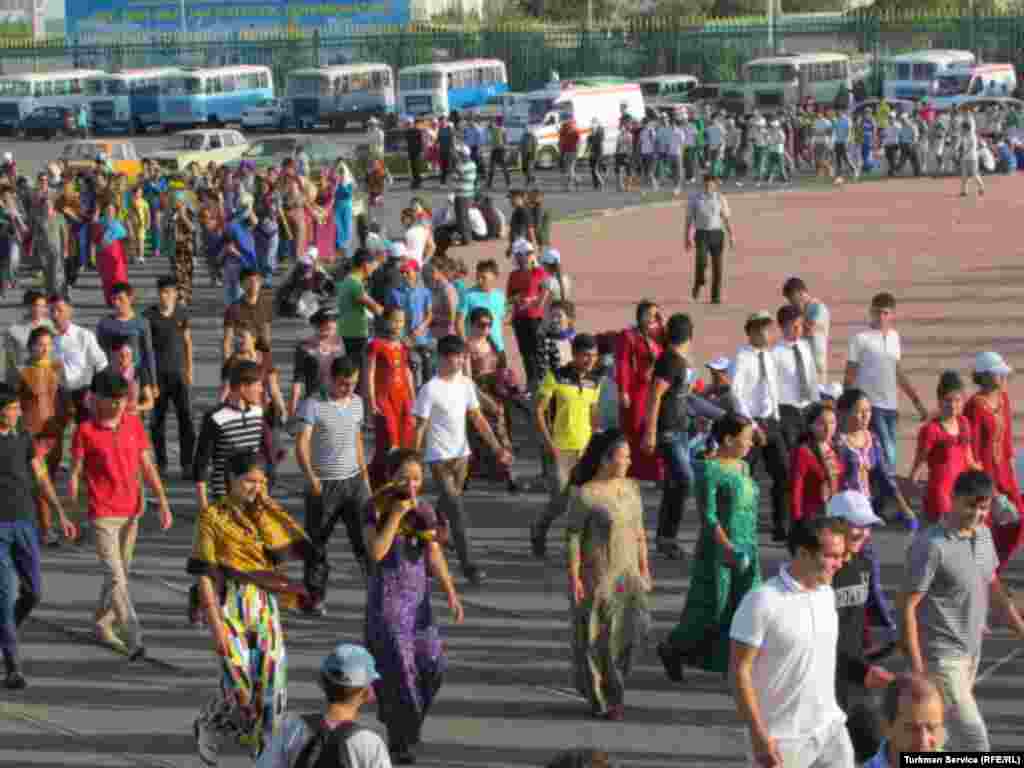 Young people congregate on the running track of the Labor Stadium in Turkmenabat while participating in preparations for Turkmenistan's Independence Day celebrations.