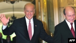 Romanian President Traian Basescu (right) says the topic came up during an October visit by U.S. Vice President Joe Biden.