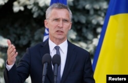 NATO Secretary-General Jens Stoltenberg speaks during a press conference with Ukrainian President Petro Poroshenko following a meeting of the NATO-Ukraine Commission in Kyiv on July 10.