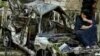 Car Bombing Kills 13 In Baghdad; Bush Vows To Stay The Course