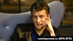 Журналист Максим Бородин на фото, предоставленном российским новостным агентством «Новый день».