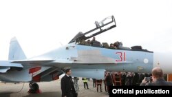 Armenia -- Prime Minister Nikol Pashinian and Defense Minister Davit Tonoyan sit in the cockpit of a Su-30SM fighter jet at an airbase in Gyumri, December 27, 2019.