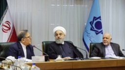 Iranian president Hassan Rouhani (C) alongside with his oil minister Bijan Zangeneh (R) and the governor of Iran's Central Bank Valiollah Seif in a meeting in the CBI headquarter in Tehran, on Sunday March 04, 2018.