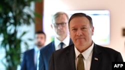 US Secretary of State Mike Pompeo and US special representative on Iran Brian Hook (background) arrive to al-Bateen Air Base in Abu Dhabi on September 19, 2019.