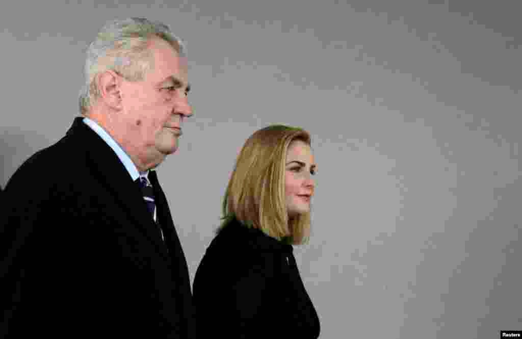 Candidate Milos Zeman and his daughter Katerina arrive at a polling station in Prague.