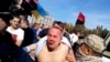 Lawmaker Nestor Shufrych was beaten by a mob in Odesa on September 30 while receiving little help from local police.