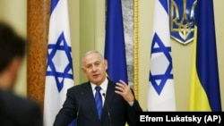 UKRAINE –Israeli Prime Minister Benjamin Netanyahu gestures while speaking during his and Ukrainian President Volodymyr Zelenskiy, joint news conference following their talks in Kyiv, August 19, 2019