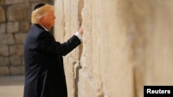 U.S. President Donald Trump places a note in the stones of the Western Wall, Judaism's holiest prayer site, in Jerusalem's Old City on May 22.