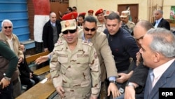 Генерал Абдул Фатах аль-Сиси на избирательном участке во время голосования про проекту новой конституции, Каир, 14 января