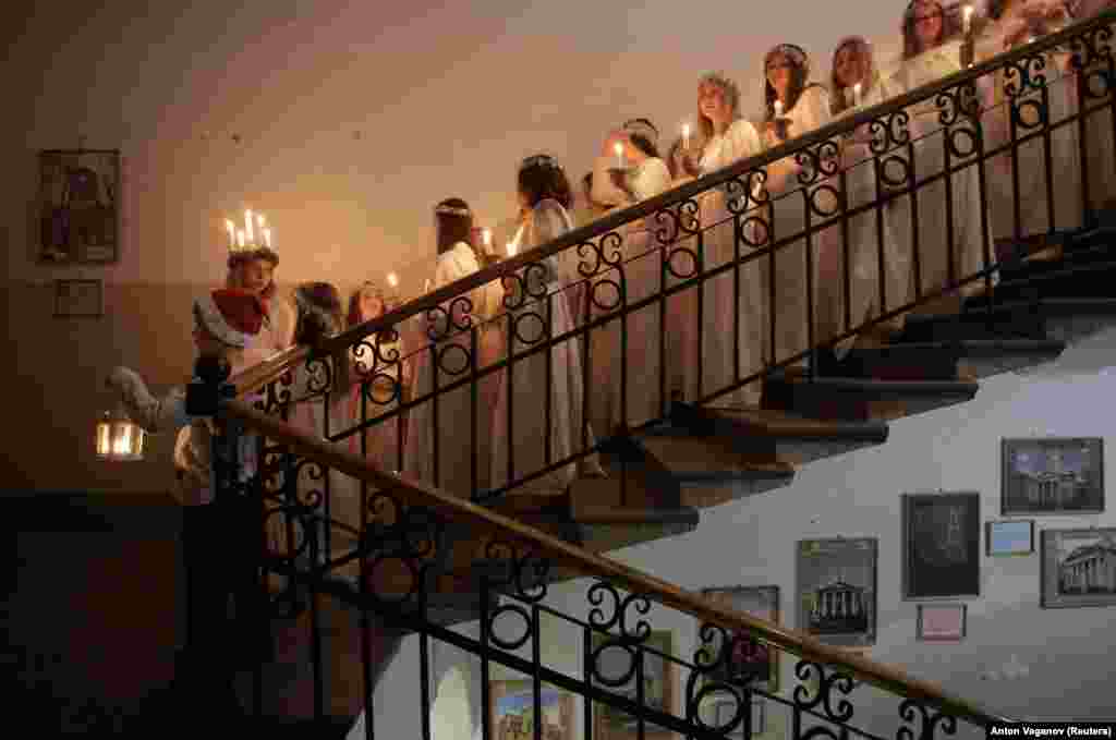 Youths wait to perform during a celebration of St. Lucia's Day at the Swedish Evangelical and Lutheran Church of St. Katarina in St. Petersburg, Russia. (Reuters/Anton Vaganov)