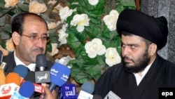 Iraqi Prime Minister Nuri al-Maliki (left) and Shi'ite cleric Muqtada al-Sadr (file photo)