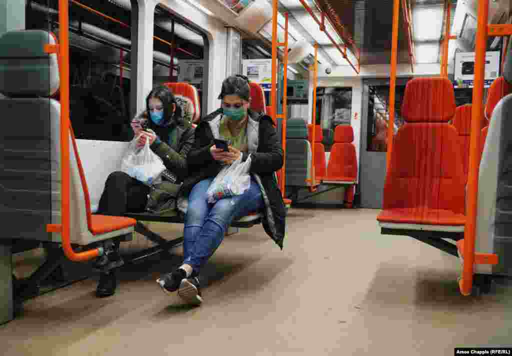 Tourists travelling in the Prague metro with surgical masks on March 14. 