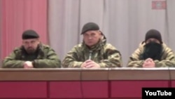 A screengrab of a video posted on YouTube showing a "people's tribunal" in action in the separatist controlled part of Ukraine.