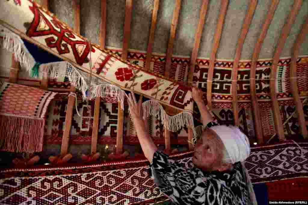 The items displayed inside the yurt, collected by Astara over many years, include gifts to her family and crafts made by her daughters and other relatives.