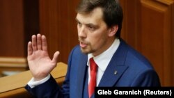 Oleksiy Honcharuk addresses lawmakers during the first session of the newly elected parliament in Kyiv on August 29.