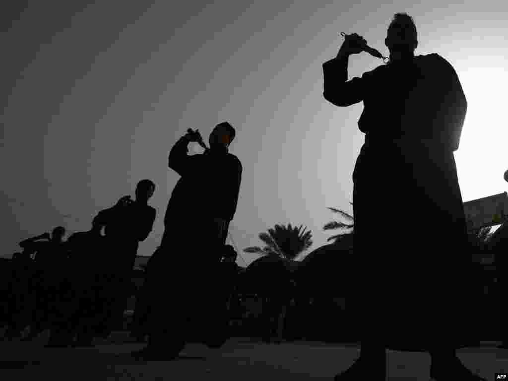 Shi'ite men ritually whip themselves with chains in an effort to share the suffering of Hussein, demonstrate piety, and spurn the trappings of the flesh and worldly concerns.