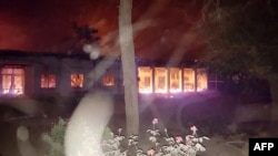 In this photograph released by MSF on October 3, fires burn in part of the MSF hospital in the Afghan city of Kunduz after it was hit by air strikes.