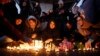 Iranians light candles for victims of Ukraine International Airlines Boeing 737-800 as they protest in front of Amir Kabir University in Tehran, Iran, 11 January 2020. 