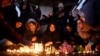Iranians light candles for victims of the plane crash as they protest in front of Amir Kabir University in Tehran on January 11. 
