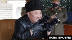 North Korean leader Kim Jong Un visits a long-range artillery drill at an undisclosed location in 2020.