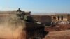 تانک ارتش سوریه در این تصویر از ۱۸ اوت/۲۷ مرداد در نزدیکی خان شیخون دیده می‌شود