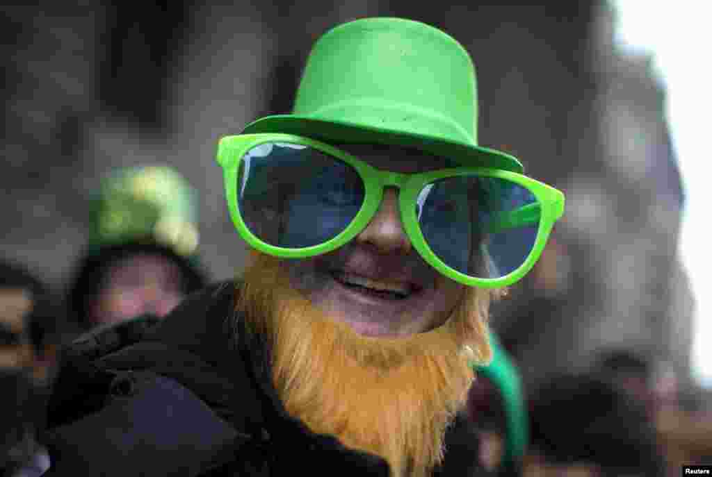 Carl McCormack from Scotland wears a St. Patrick's Day costume as he stands with thousands of spectators to watch the New York City St. Patrick's Day parade up 5th Avenue in Manhattan. (Reuters/Mike Segar)