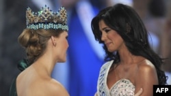 Miss Venezuela, Ivian Sarcos (right), is congratulated by Miss World 2010, Alexandria Mills of the United States, after winning Miss World 2011 in London.