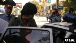 Kazakh police detaining the protesters on September 30.