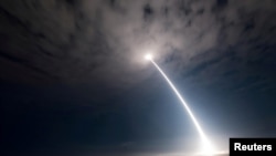 An unarmed Minuteman III intercontinental ballistic missile takes flight during an operational test at Vandenberg Air Force Base, California, in August 2017.